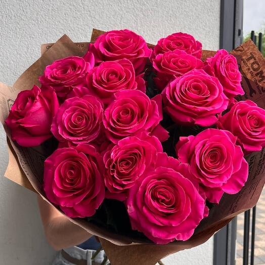 15 bridght pink roses in kraft paper
