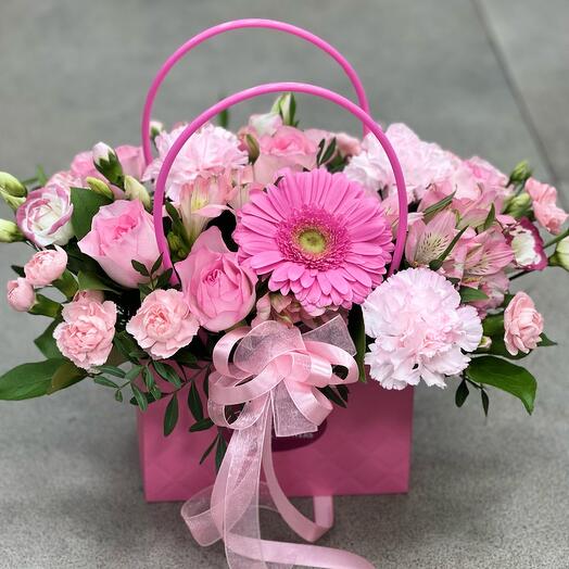 Pink composition in a handbag